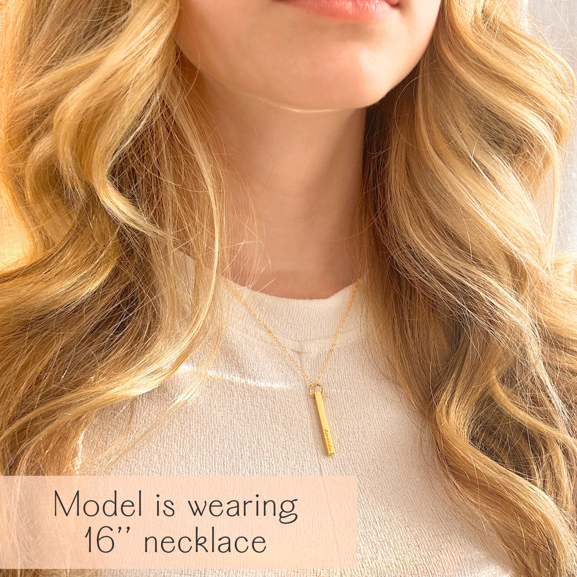 Lifestyle view of a woman wearing a single dainty gold custom bar necklace, the 3D pendant resting at collarbone length for effortless daily wear. Personalize with initials, children’s names, wedding date or Roman numerals to create a modern name bar necklace. Great for birthdays, anniversaries, graduations and thoughtful mothers necklace with names alternatives in a clean, minimalist silhouette.