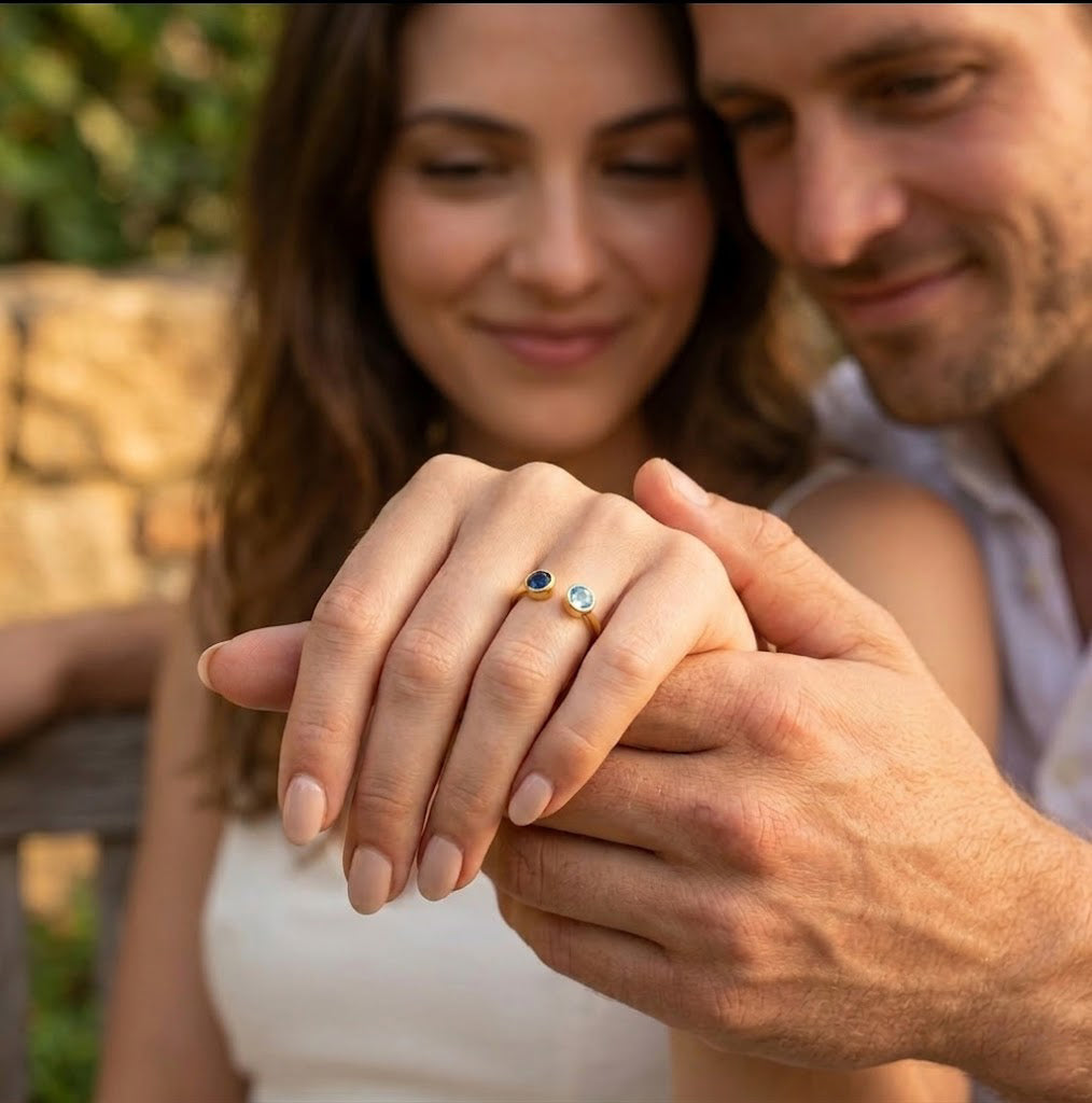 Couple wearing matching or complementary birthstone rings, symbolic jewelry representing love, connection, and shared moments