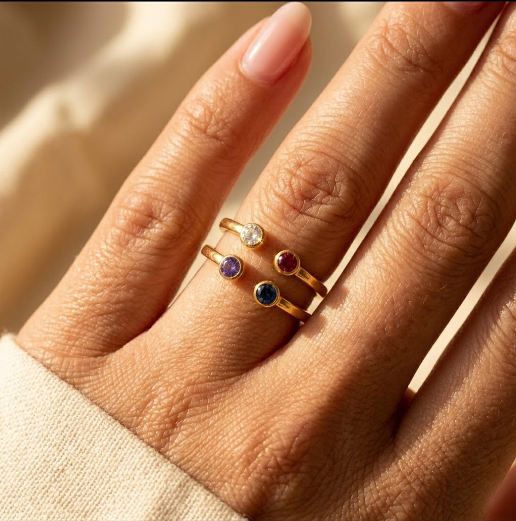 Stacked birthstone rings with natural gemstones on hand, minimalist layering jewelry for modern personalized styling