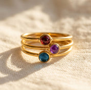 Close up opalite ring with smooth cabochon gemstone