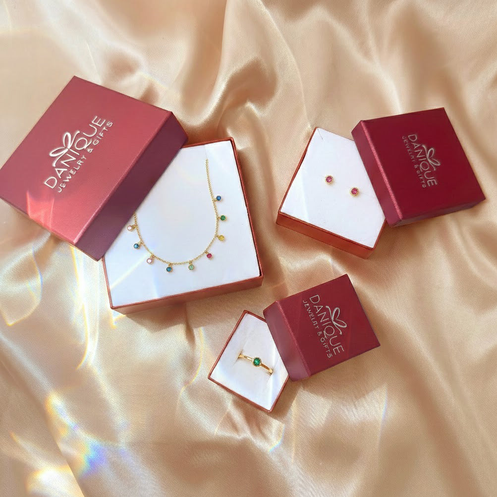 Danique Jewelry gift boxes with tiny birthstone studs and matching jewelry pieces for gifting