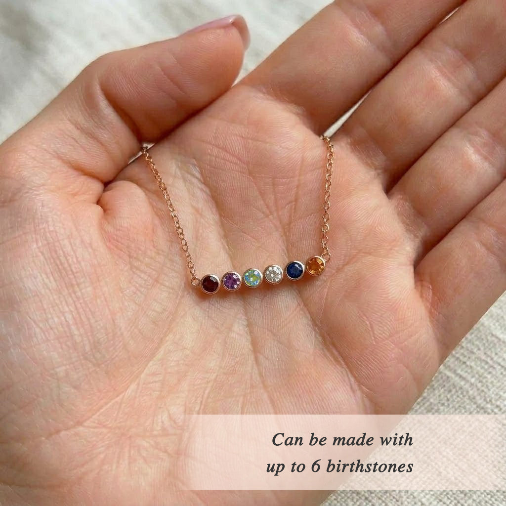 Custom birthstone anklet with colorful gemstones on a delicate gold chain, personalized with up to six stones for kids, grandkids, sisters, or friends.