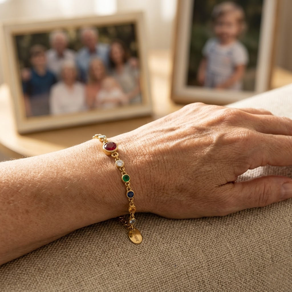 Hand holding personalized birthstone bracelet for grandma with grandkids birthstones and initials, thoughtful Mother’s Day gift symbolizing motherhood and love

