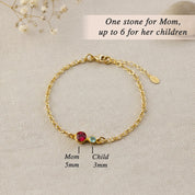 Our rose gold birthstone bracelet for mom highlights a 5mm gemstone representing her and up to six 3mm stones symbolizing her children, creating an elegant family jewelry keepsake full of meaning.