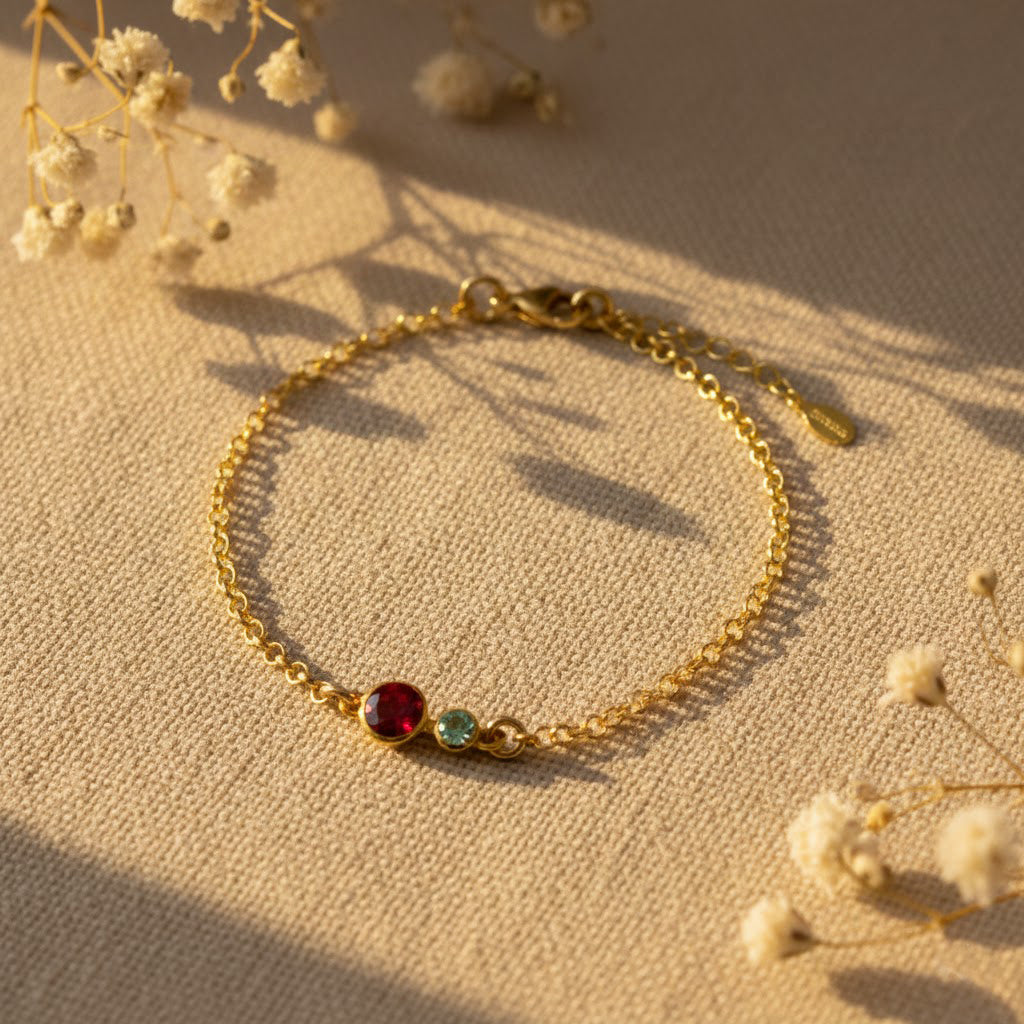 This custom mom birthstone bracelet features one larger 5mm stone for mother and up to six 3mm children birthstones on a delicate gold chain, creating a minimalist family keepsake jewelry piece perfect for Mother’s Day or a sentimental push present.