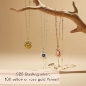 Custom birthstone sun pendant necklaces in gold, sterling silver and rose gold hanging from a sculptural wood branch on a warm beige background, each radiant sunburst pendant featuring a different colorful gemstone center on a delicate satellite chain. Personalized sun necklace perfect as a custom birthstone gift for her, ideal for birthdays, Mother’s Day, Christmas or bridesmaids, and a dainty everyday layering piece.