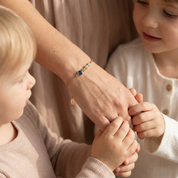 Crafted in sterling silver, this custom mother and child birthstone bracelet features adjustable sizing and a minimalist bar layout, making it a thoughtful anniversary, birthday, or Mother’s Day gift.