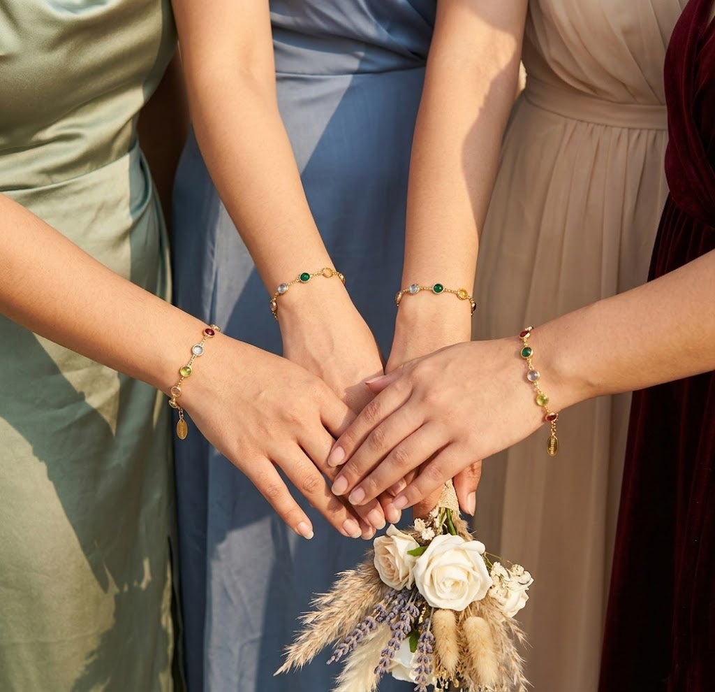 stackable birthstone bracelets with colorful gemstones, custom family bracelet aesthetic jewelry trend on bridesmaids hands