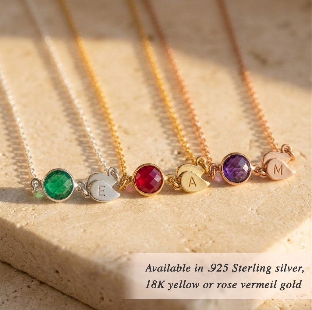 Gold birthstone necklace with initial charm representing children