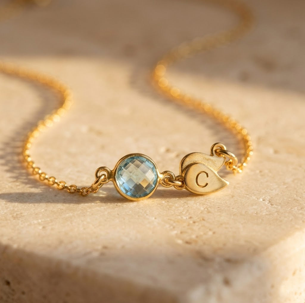 Minimalist gold necklace with single birthstone and initial pendant