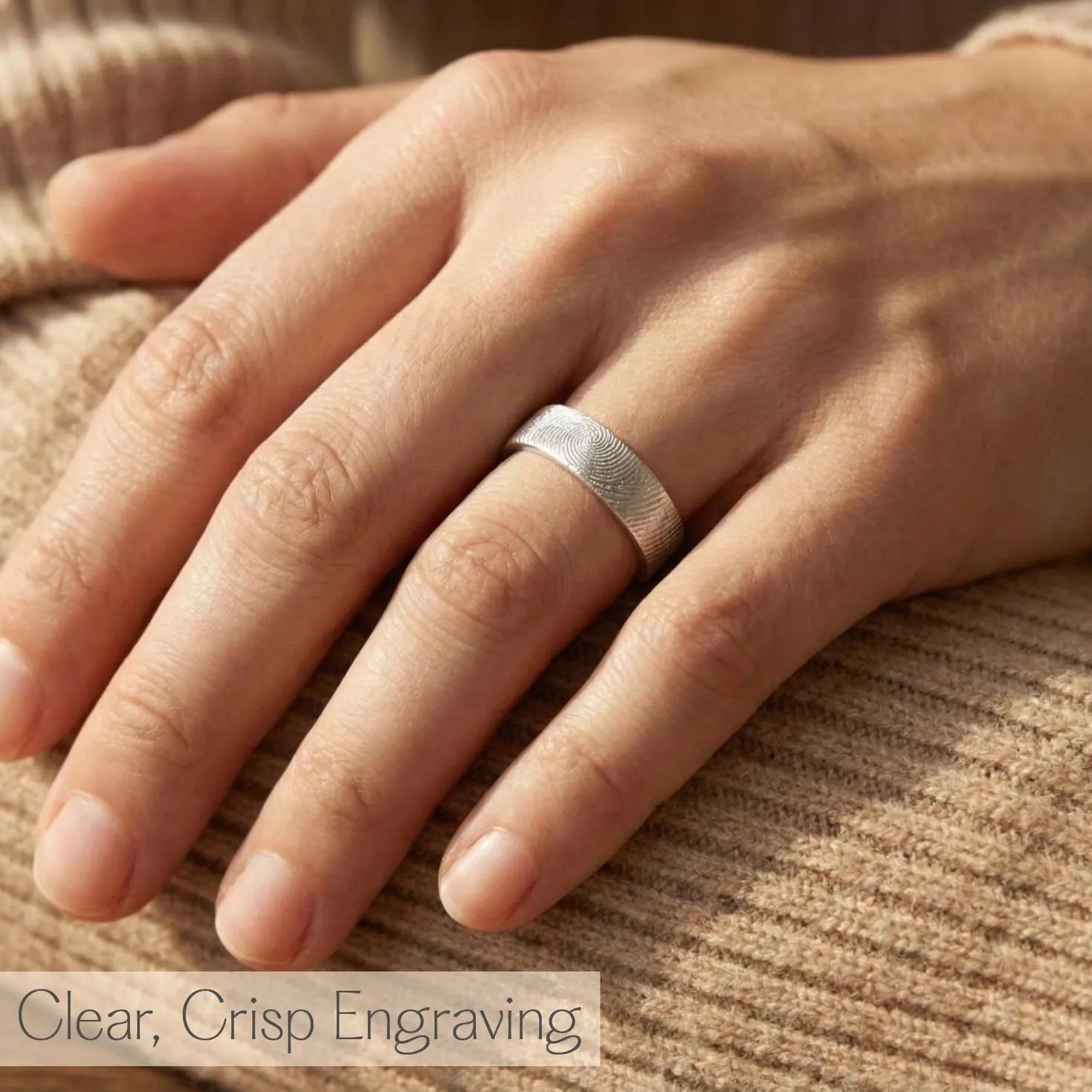 Custom fingerprint engraved rings in gold and silver displayed on soft fabric, featuring detailed fingerprint textures on the outside and a hidden engraved message inside. These unique personalized bands are perfect as his and hers wedding rings, memorial rings, or anniversary gifts. Crafted in high-quality sterling silver and gold vermeil, each ring is designed to capture the touch of a loved one, making it a timeless keepsake for couples, partners, or families.