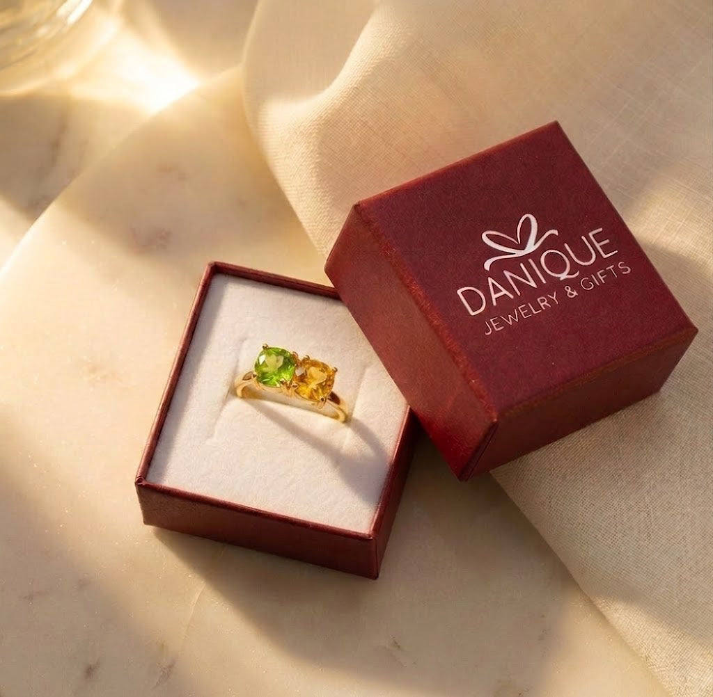 Custom two birthstone ring displayed inside a Danique Jewelry gift box.