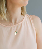 Model wearing gold cross necklace on satellite chain. Birthstone jewelry, first communion gift, easter gift, religious jewelry, cross jewelry, cross necklace, baptism gift, communion gift, gift or her, religious necklace, engraved cross charm, gift for mom, gift for teen, gift for girl, christmas gift, valentine's gift, birthday gift, anniversary gift. 