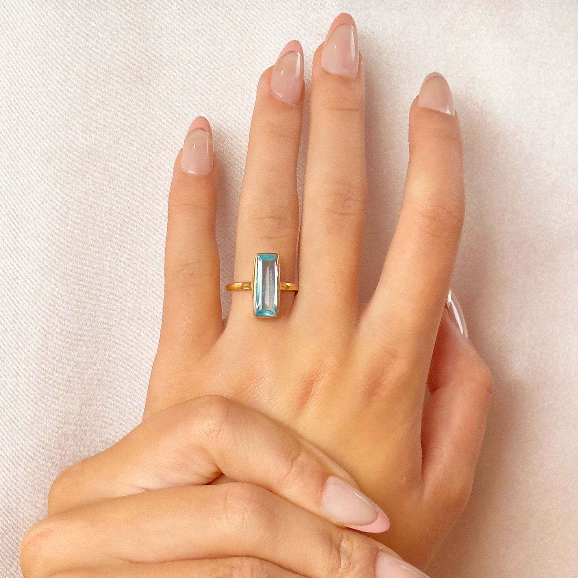 Blue-topaz-december-baguette-adira-ring-model.jpg