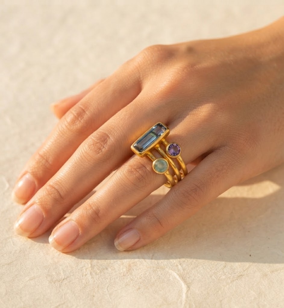 Woman wearing personalized Mom and kids birthstone stacking ring set
