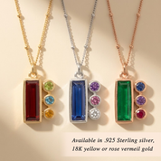 Personalized birthstone necklace for moms, shown in silver with a blue baguette mom stone and tiny kids’ gemstone charms in sterling silver or rose gold