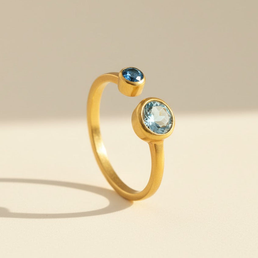 Single Gold filled open adjustable birthstone ring with 5mm blue topaz and 3mm kyanite stones.