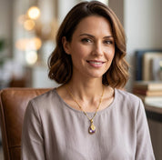 Woman wearing personalized June birthstone necklace with lavender alexandrite quartz pendant and name charm