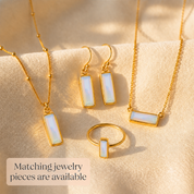 Matching Opalite bar necklace, earrings and geometric ring displayed together in yellow gold.