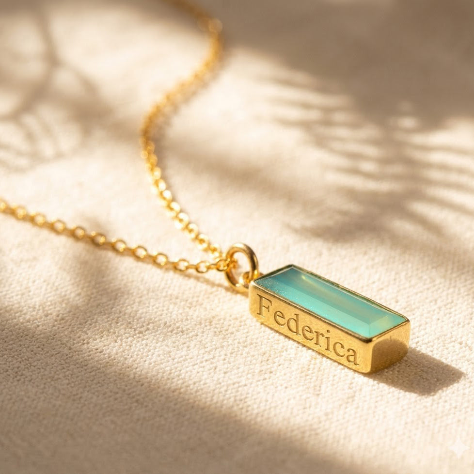 Aqua chalcedony bar necklace with hidden engraved name, personalized March birthstone necklace on a delicate gold chain.