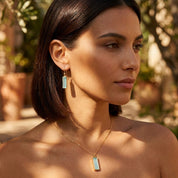 Gold aquamarine-style bar necklace with hidden name engraving, a sentimental personalized gift for mom, wife, or girlfriend.