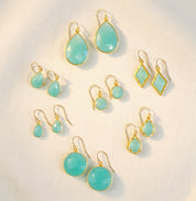 Aqua chalcedony earrings collection in gold with teardrop, round, oval, and geometric shapes, March birthstone earrings for women
