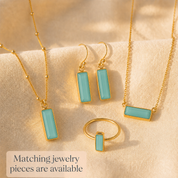 Matching aqua chalcedony jewelry pieces with bar earrings, necklace, bracelet, and ring.