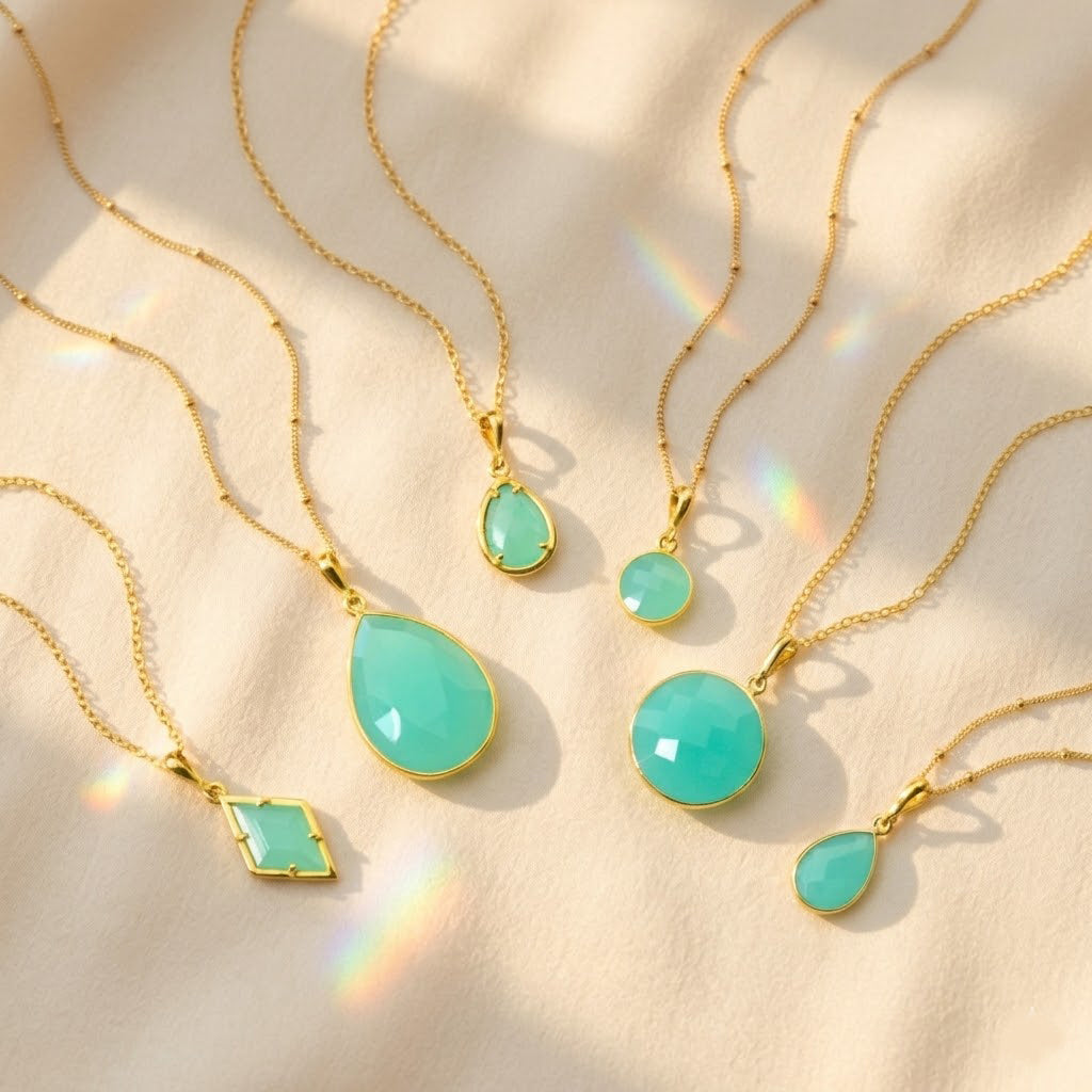 Aqua chalcedony necklace collection in gold with teardrop, round, oval and geometric pendants March birthstone jewelry