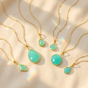 Aqua chalcedony necklace collection in gold with teardrop, round, oval and geometric pendants March birthstone jewelry