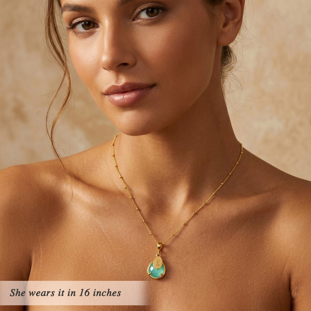 Woman wearing aqua chalcedony necklace with engraved name charm, dainty March birthstone jewelry in gold