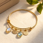 Custom birthstone bangle bracelet with teardrop birthstone charms and initial discs, personalized family bracelet for mom or grandma.