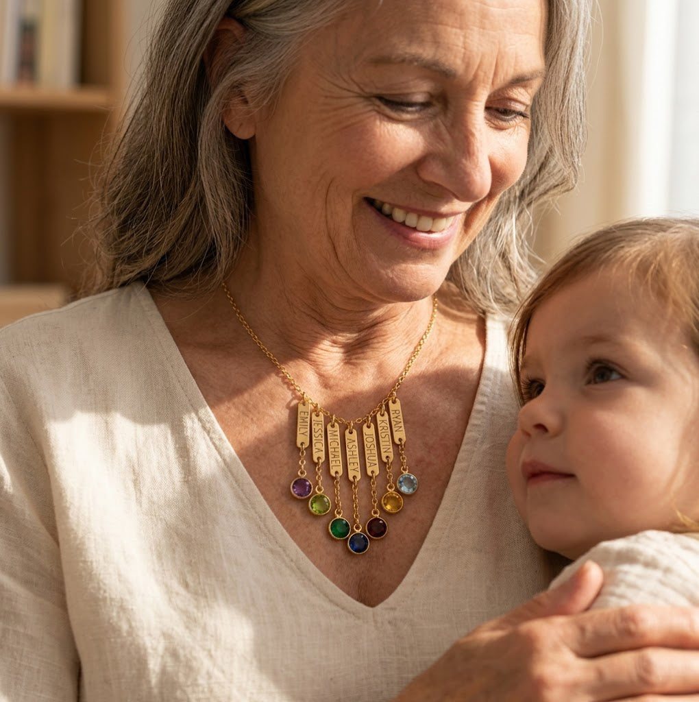 Grandmother wearing engraved name and birthstone necklace with grandchild, personalized grandma necklace with custom birthstone charms.
