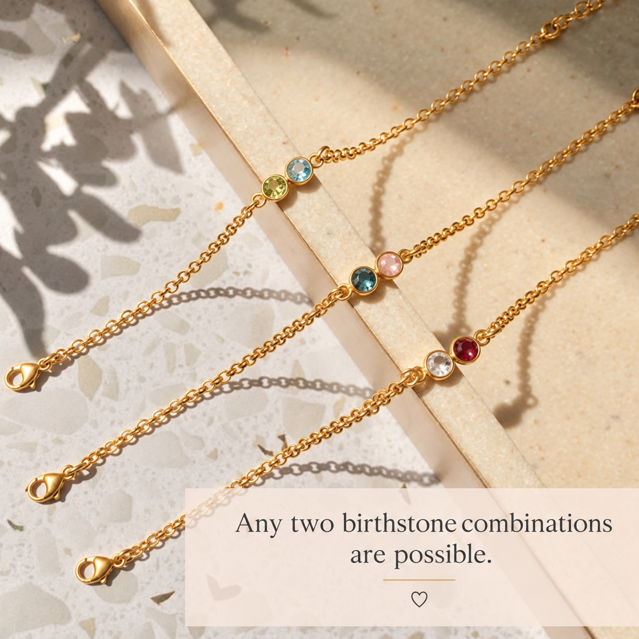Gold bracelets displaying different two birthstone combinations
