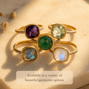 Cushion-cut pavé rings displayed in several gemstone colors and metal finishes.
