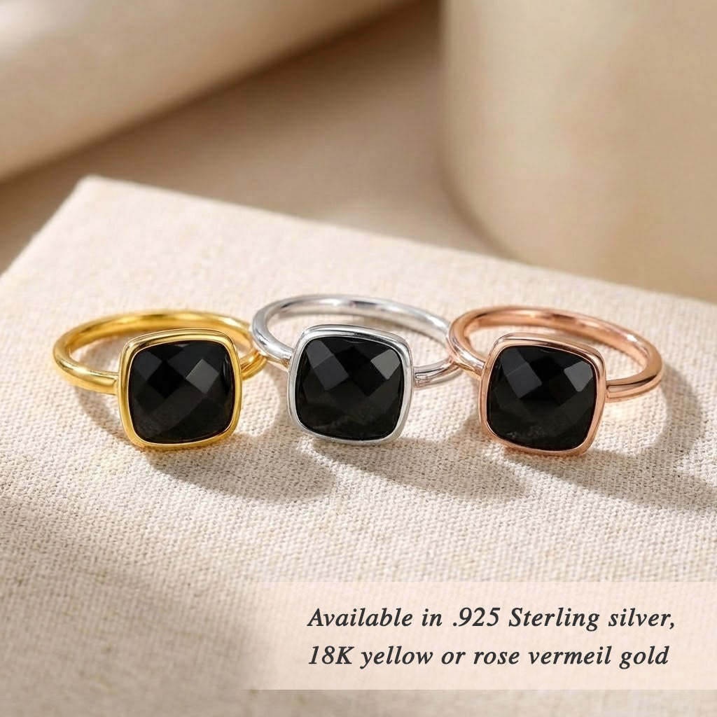 Gold black onyx ring on neutral background, faceted square gemstone ring, bold yet minimal jewelry piece, available in sterling silver and gold finishes, contemporary fine jewelry