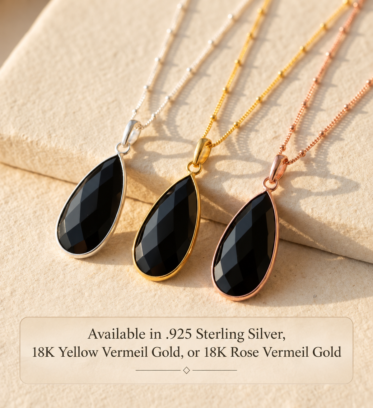 Black Onyx teardrop necklaces shown in sterling silver, yellow gold and rose gold finishes.

