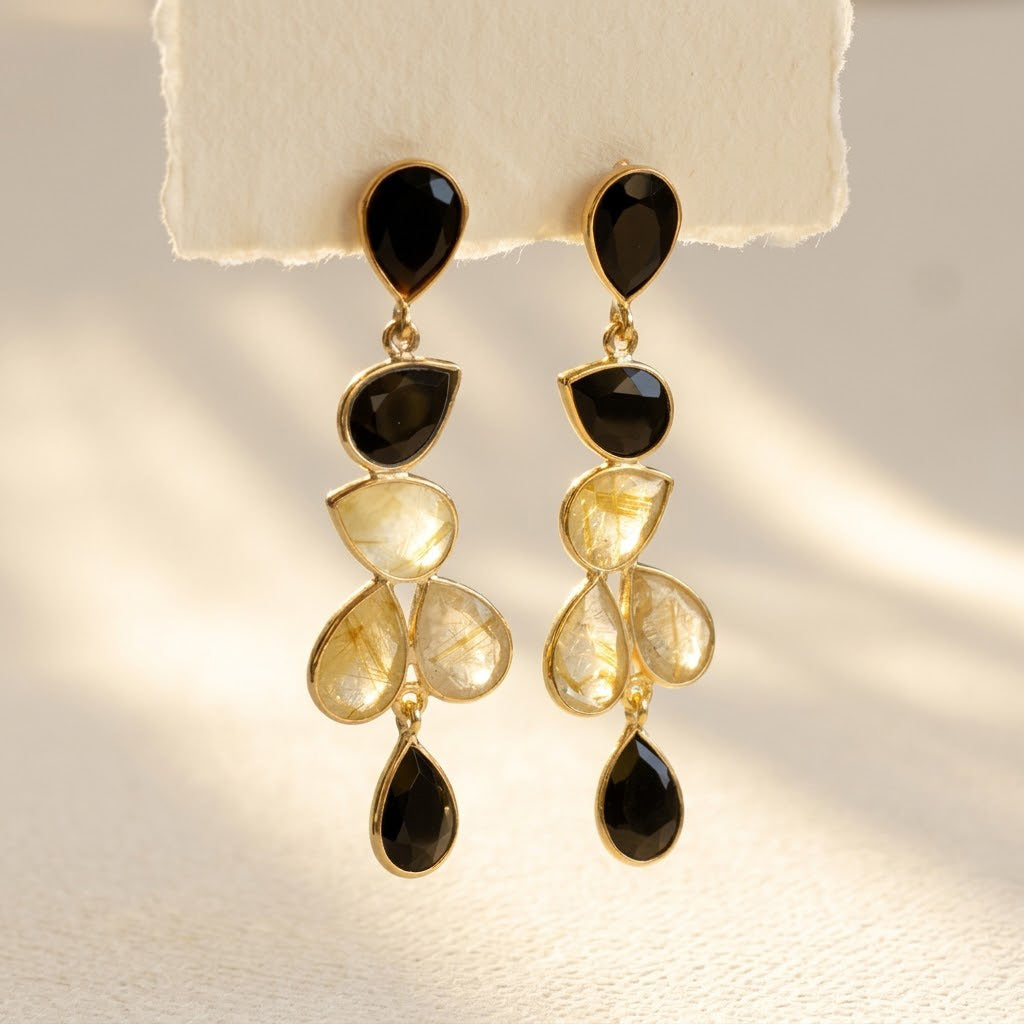 Rutilated quartz and black onyx earrings in gold with natural gemstone drop design
