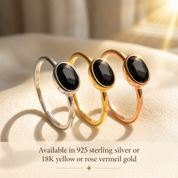 Small oval birthstone rings stacked in yellow gold vermeil in natural light