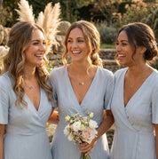 Layered birthstone necklaces shown on bridesmaids.