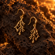 Gold coral branch dangle earrings video on dark textured background