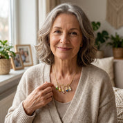 2. Lifestyle
Grandmother wearing a personalized family tree necklace with children or grandchildren birthstones and engraved name charms.

