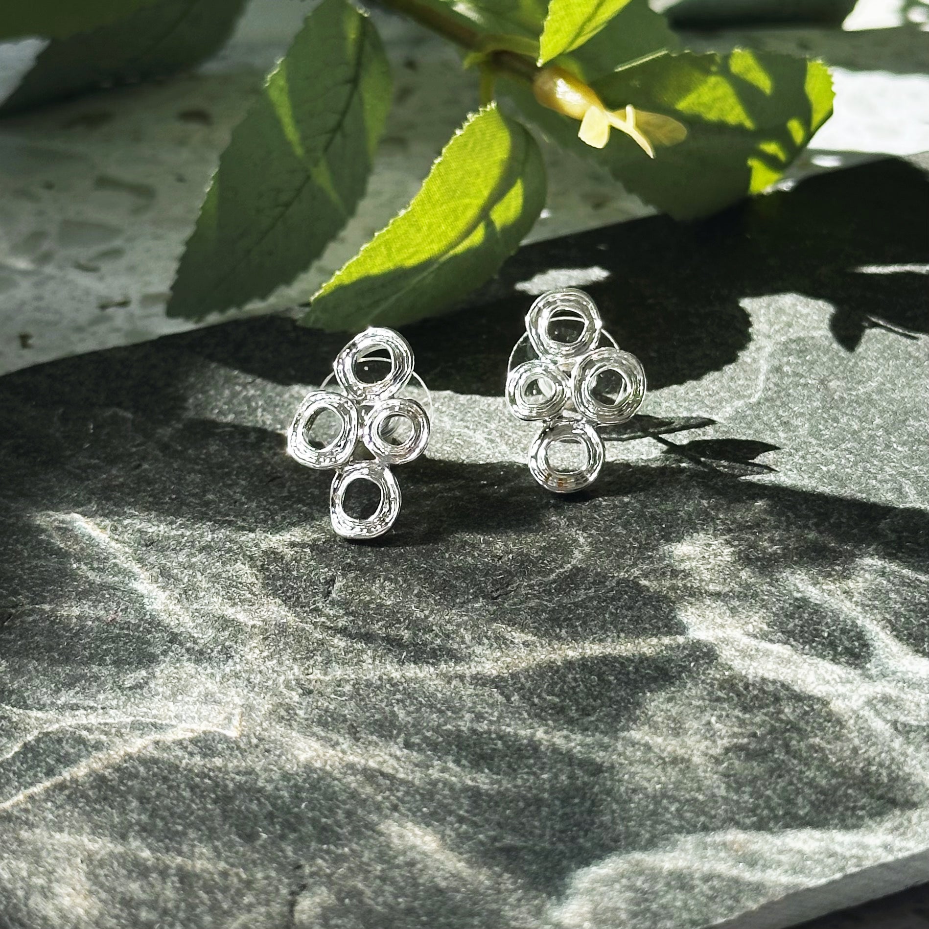 Abstract boho syle double circle statement earrings, jewelry for summer, summer vacation fashion, statement geometric pendant, jewelry to wear to anniversary dinner, date night jewelry, artsy standout jewelry, silver stud earrings, gold stud earrings, boho earring collection