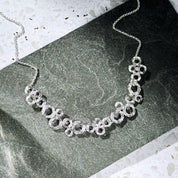Zinc alloy with galvanic silver finish circles bubble necklace set on stone background. Bubble necklace, boho jewelry, boho necklace, boho earrings, gold, silver, pushback earrings, push back earring, stud earrings, statement necklace set, statement set, gift for her, gift for mom, mother's day jewelry, mother's day gift, nature inspired jewelry, nature inspired necklace