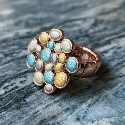 Sea Glass Glow Bubble Cluster adjustable ring displayed on gray stone
