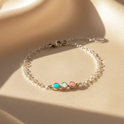 Minimalist sterling silver tiny cabochon birthstone bar bracelet with pastel multicolor stones, dainty chain and secure clasp, adjustable length stacking bracelet for everyday wear, personalized jewelry gift for moms, grandmas and friends.