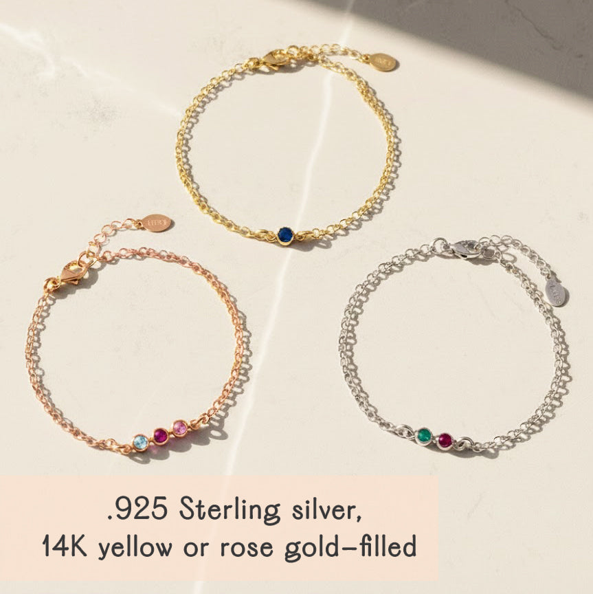 Tiny cabochon birthstone bar bracelets in sterling silver, yellow gold and rose gold filled, shown together on satin background, customizable with one to five birthstones for family or friendship jewelry, perfect layered stacking bracelet gift idea.