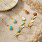 Product-only image of an oval amazonite ring featuring a smooth cabochon turquoise stone set in a minimalist gold band. Handmade gemstone ring designed for everyday wear, stacking, or wearing alone as a statement piece.