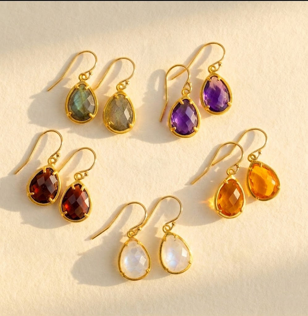 gold birthstone necklace and earrings set with teardrop stones representing kids and loved ones