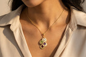 Model presenting a personalized family necklace featuring multiple engraved discs and birthstones—symbolic of children or grandchildren. A cherished gift idea for moms, grandmothers, or mothers-in-law to celebrate growing families.