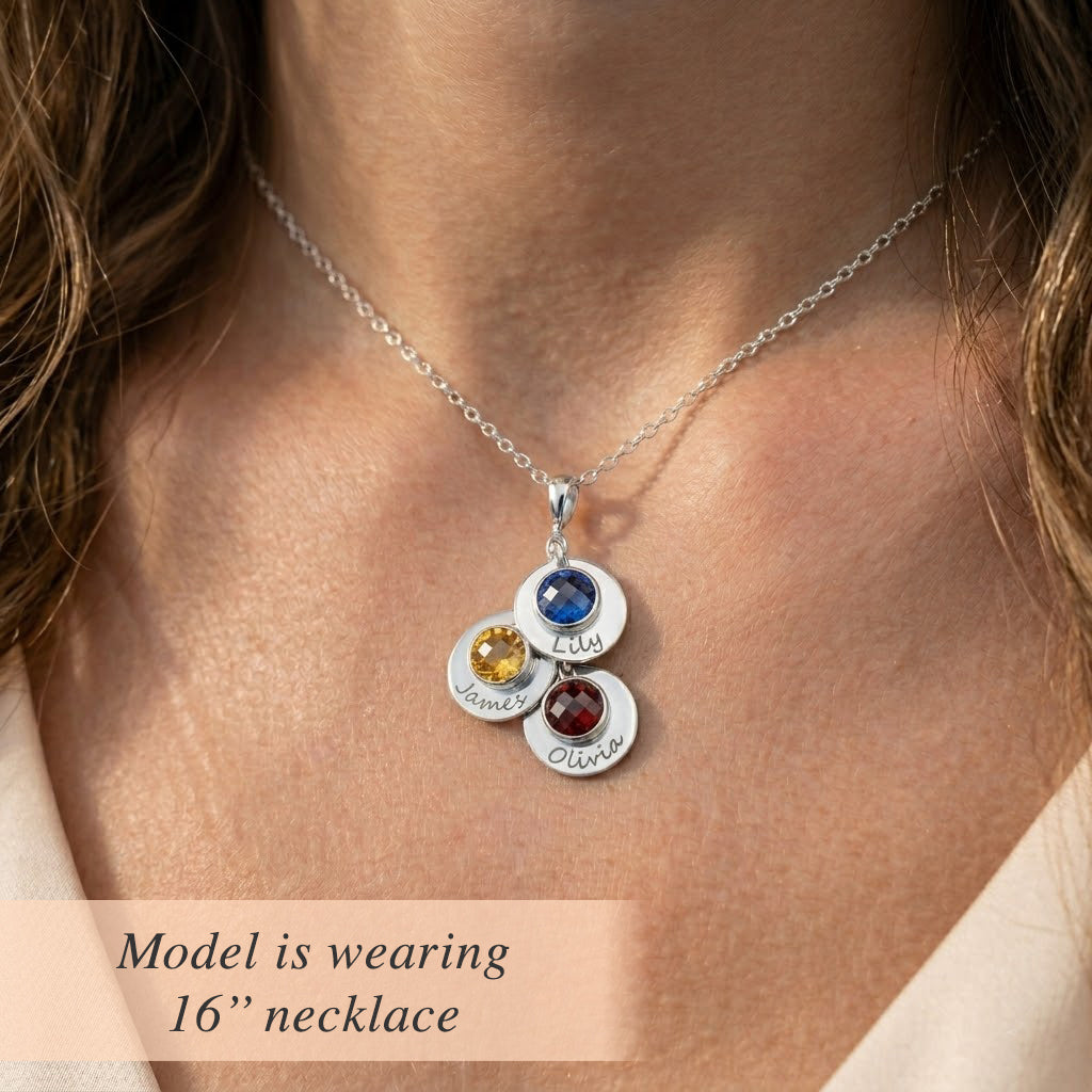 Woman wearing a personalized mom or grandma necklace with engraved name discs and natural birthstones on a delicate chain. A meaningful everyday keepsake for moms, grandmothers, and mothers-in-law, perfect for gifting on Mother’s Day, birthdays, or as new grandma gifts.
